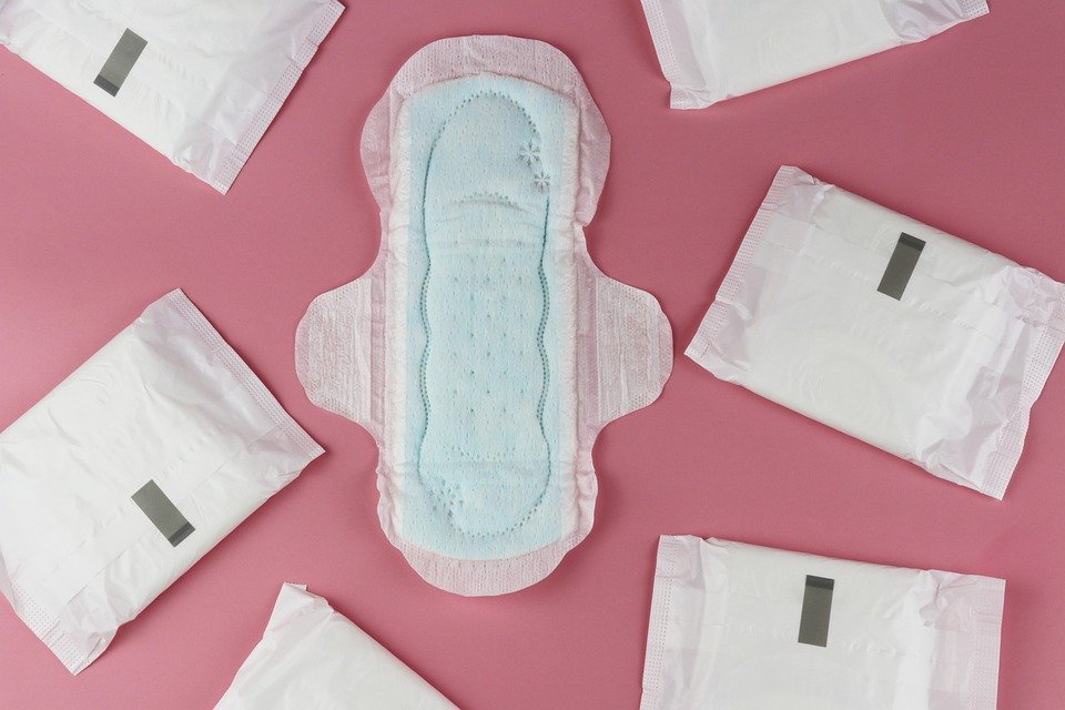 Image of menstrual pads on a pink background