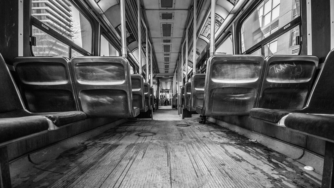 Image in black and white of the interior of a bus