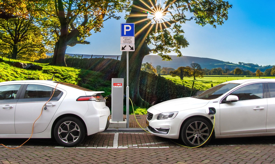 Image of two electric vehicles charging