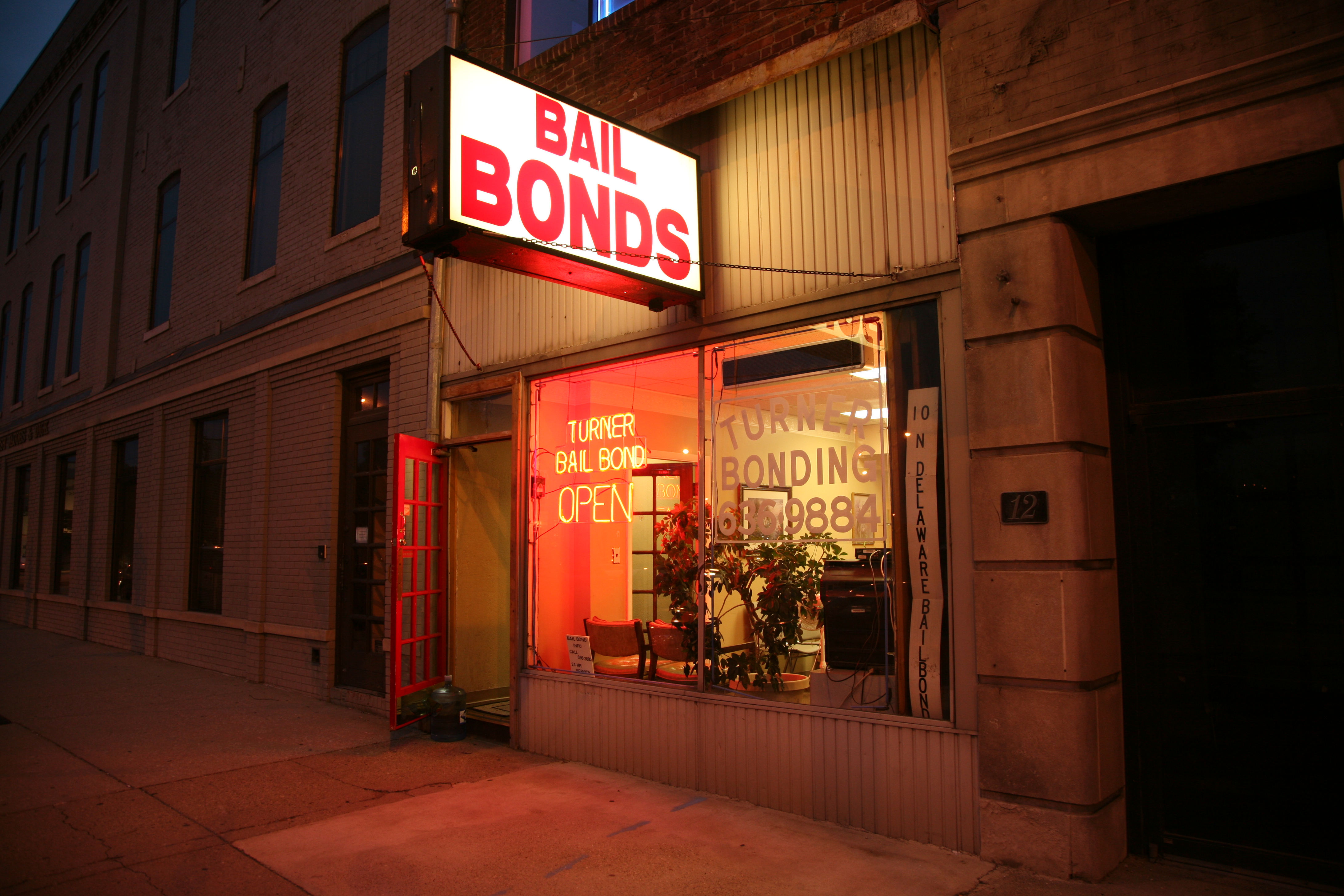 Image of a bail bond agency sign and storefront