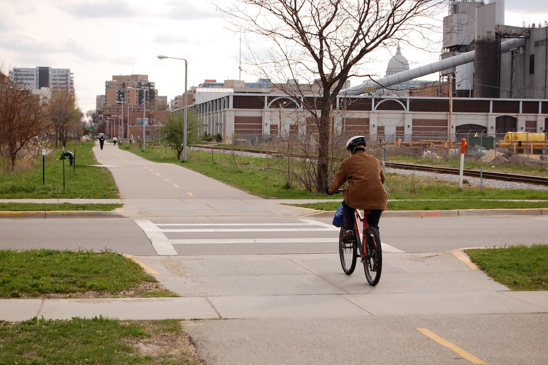 Image of a bicyclist on a bike path in Madison, WI