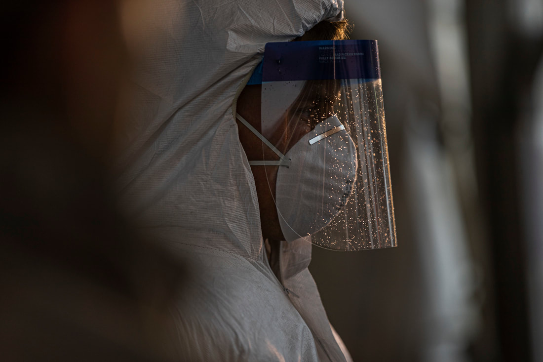 Image of New Jersey National Guard Soldier/Airperson wearing of protective equipment at a COVID-19 Community-Based Testing Site at the PNC Bank Arts Center in Holmdel, N.J., March 23, 2020.